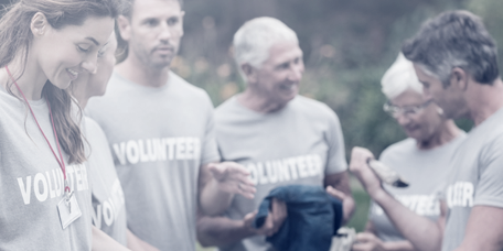 Volunteers distributing food as part of an association