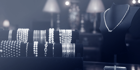 Series of jewellery bracelets and necklaces on display in a jewellery shop