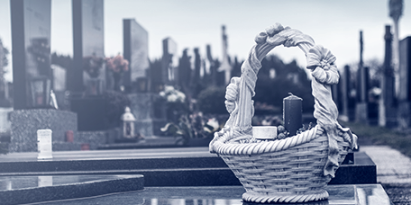 Flowers and candles on gravestones at the cemetery