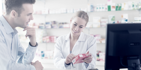 Pharmacist advising a client on medicines